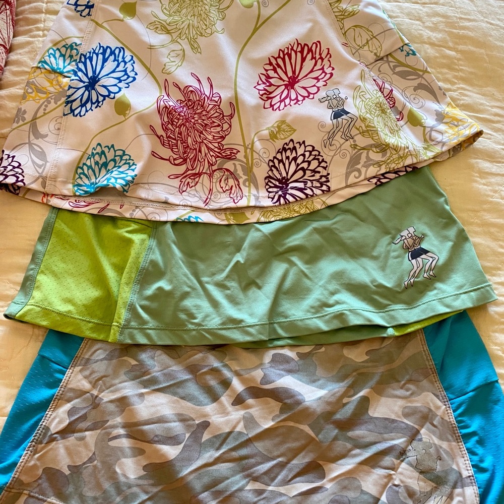Lot of three runningskirts.com running skirts.